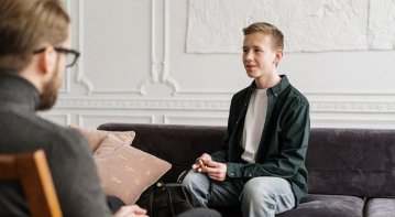 A compassionate mental health counselor supports a client in a peaceful therapy setting, symbolizing emotional healing, personal growth, and long-term resilience.