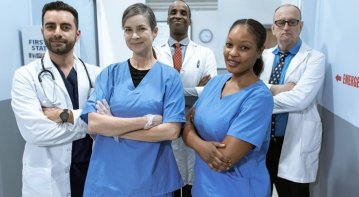 Confident nurse leader in uniform addressing a diverse medical team in a hospital meeting room, symbolizing the skills, dedication, and leadership required in nursing.