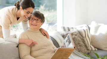 Illustration of seniors engaging in group activities, nature walks, and wellness programs in an assisted living community designed for holistic wellbeing