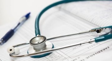 A healthcare professional balancing work and personal wellness, showing a doctor or nurse holding medical tools in one hand and relaxation items like a yoga mat or plant in the other, symbolizing harmony between career and self-care