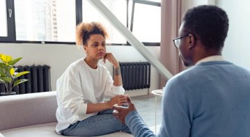 A diverse group of people sitting together in a support circle, sharing and listening attentively, symbolizing the growing awareness and importance of mental health support in modern society