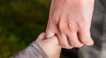 A compassionate professional providing emotional support during a counseling session, symbolizing dedication, empathy, and active listening essential for building a career in emotional support.