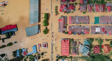 Community social workers offering counseling and relief support after a natural disaster.