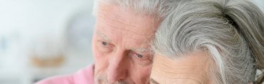 Older adult practicing mindfulness meditation in a peaceful setting, promoting emotional healing and well-being in later life.