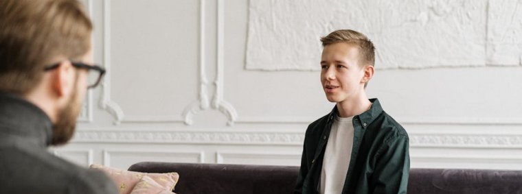 A compassionate mental health counselor supports a client in a peaceful therapy setting, symbolizing emotional healing, personal growth, and long-term resilience.