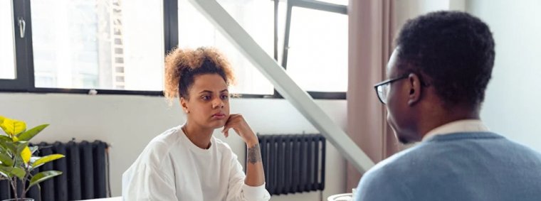 A diverse group of people sitting together in a support circle, sharing and listening attentively, symbolizing the growing awareness and importance of mental health support in modern society